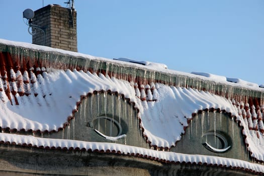 two old windows with icicles
