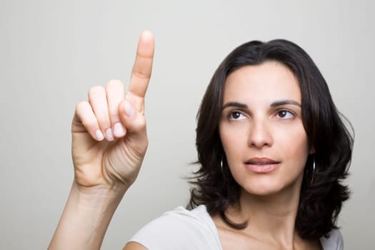 Woman presses on a virtual screen
