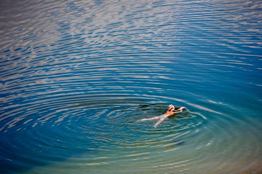 Woman swimming in a lake