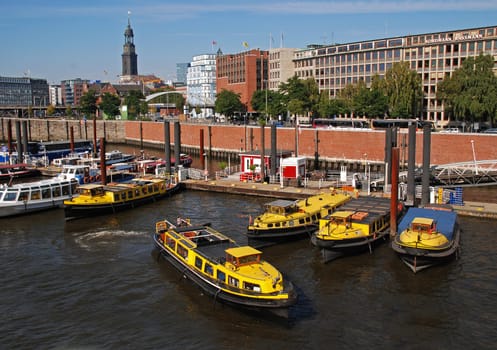 yellow tugboats in the port of Hamburg