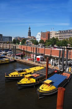 yellow tugboats in the port of Hamburg