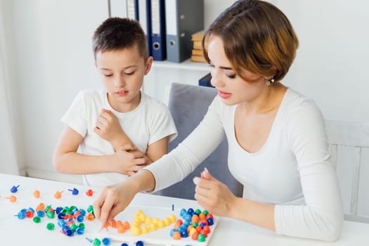 educational games for children a child psychologist is engaged with a child in the office