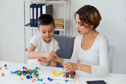 educational games for children a child psychologist is engaged with a child in the office