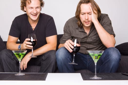 two friends drinking at home