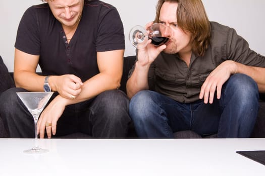 two friends drinking at home
