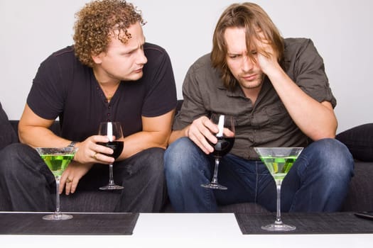 two friends drinking at home