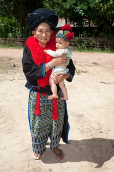 Portrait of woman Asia with baby,ethnic group Yao