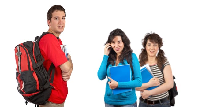 Three students with books and backpacks