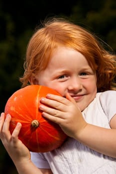 Girl with pumpkin