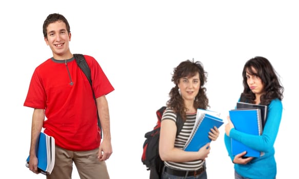 Three students with books and backpacks