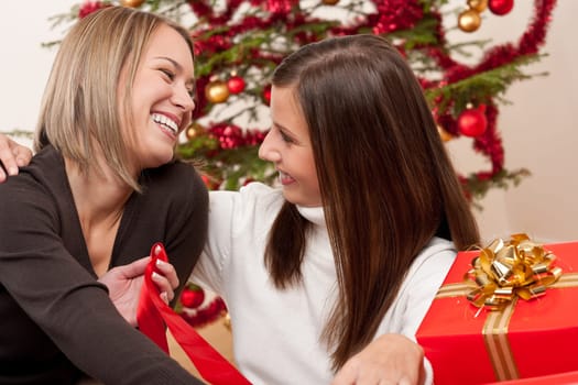 Two women with Christmas present