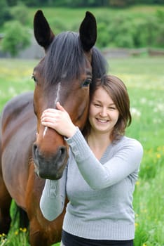 Young woman with horse