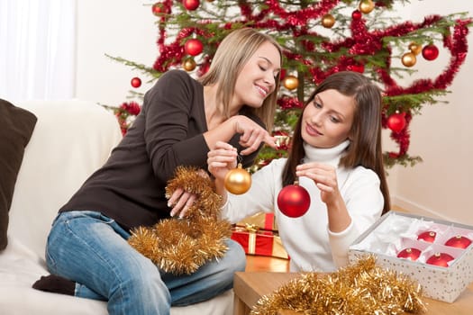 Two women with Christmas decoration