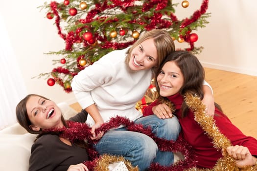 Three cheerful women on Christmas