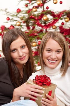 Two women with Christmas present