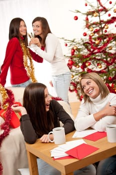Four smiling women on Christmas