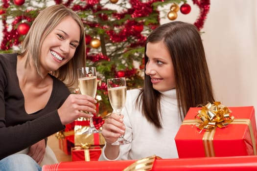 Two women with Christmas present