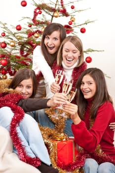 Four smiling women on Christmas