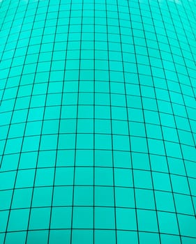Teal color grid from side of building