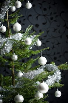 Silver decorated Christmas tree with balls and chains