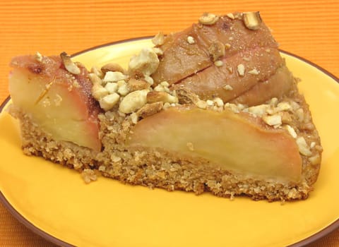 A piece of apple pie on ceramic plate