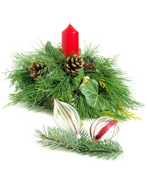 Christmas - wreath from fresh twigs and cones with red candle