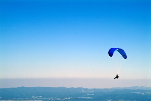 Hang gliders above the clouds