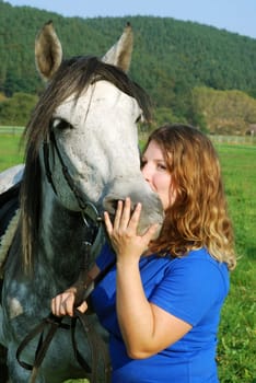 Young woman with horse