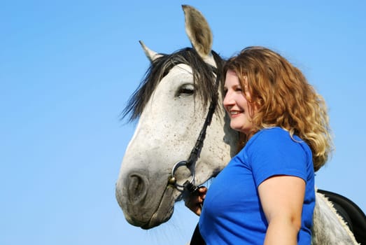 Young woman with horse