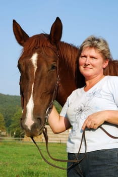 Woman with riding pony mare