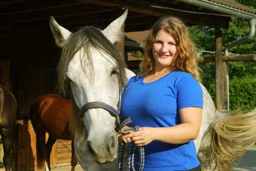 Young woman with horse