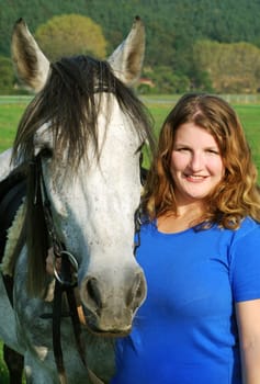 Young woman with horse