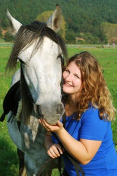 Young woman with horse