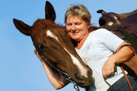 Woman with riding pony mare