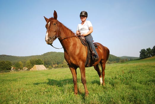 Woman with riding pony mare