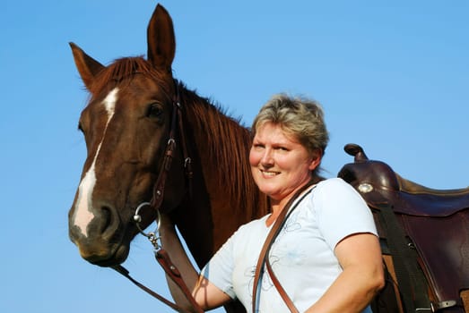 Woman with riding pony mare