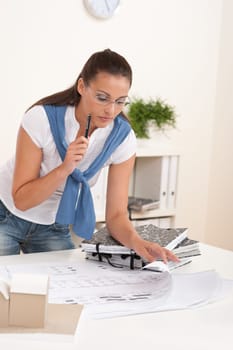 Brown hair female architect at the office