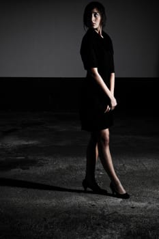 Black Dress Standing In Shadow