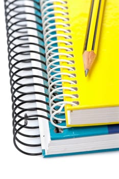 Pencil on a two notebooks