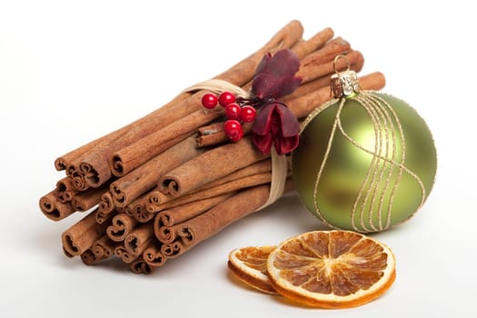 Christmas decoration with cinnamon sticks and bauble