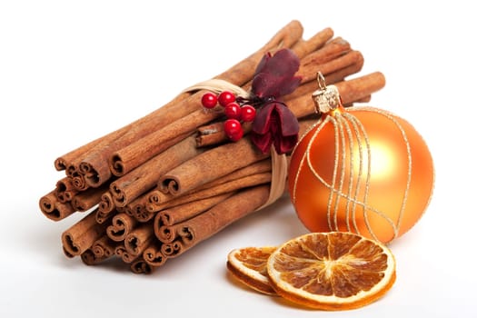 Christmas decoration with cinnamon sticks and bauble