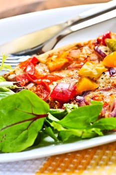 Vegetarian pizza with salad