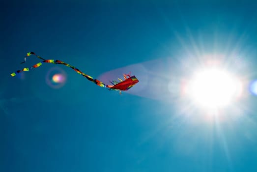 Dragon with tail and sun