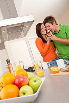 Happy couple eating toast