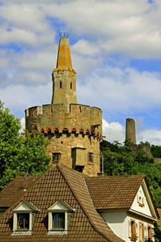 The "Red Tower"",which dates back to the 14th century,served as a prison tower for the city of Weinheim until the middle of the 19th century. (The pyramid cone above the crenellation once had a red tiled roof). Windeck Castle (in the background) was built as a"