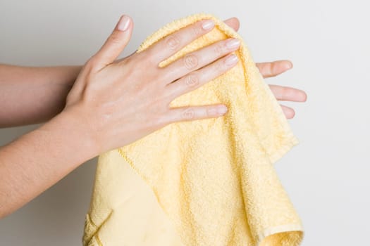 Drying hands with a towel