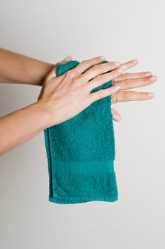 Drying hands with a towel