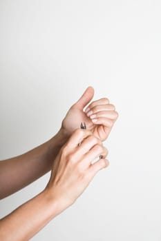Young woman doing manicure