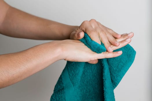 Drying hands with a towel