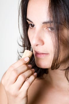 Pretty woman smells on a wine cork